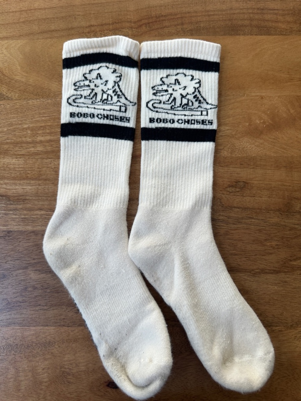 Bobo Choses White Crew Socks with Black Logo Stripes & Triceratops line drawing